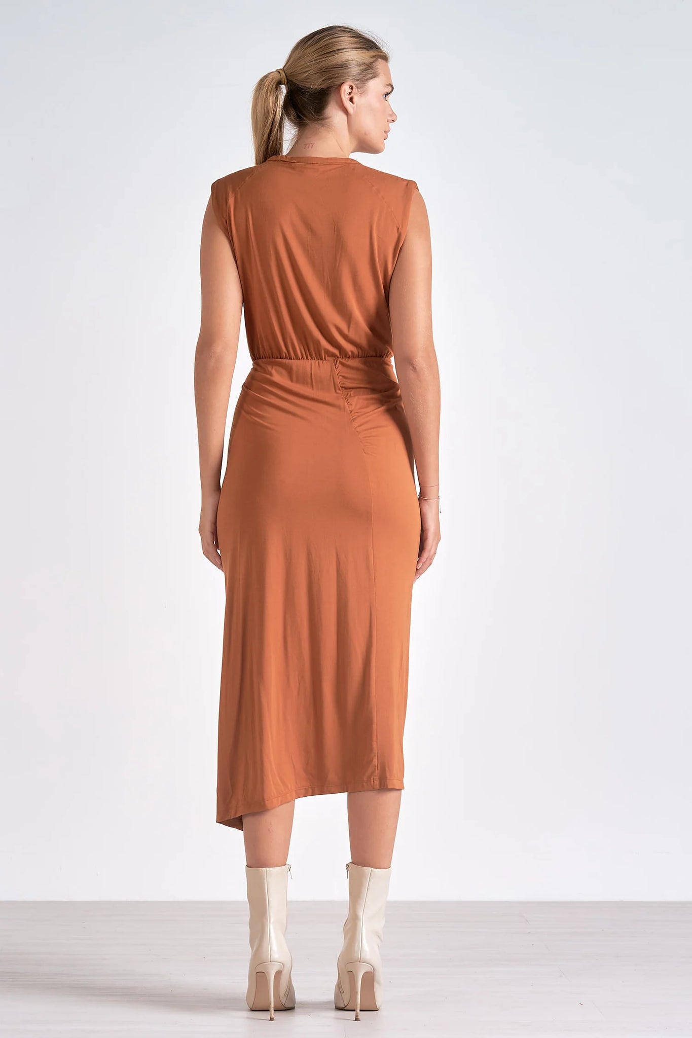 The Lenox dress lets you float through your day in sleeveless midi elegance. A front slit and cinching detail flatter the figure, while buttery-soft fabric ensures all-day comfort.