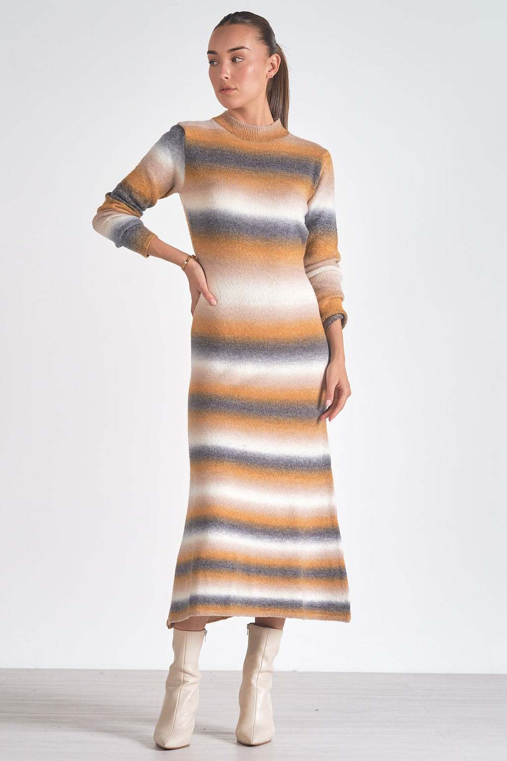 Turn up the sass factor with the Elan Baske sweater dress. This dress combines cozy comfort with stylish flair, making it the perfect choice for any occasion. With its playful design and soft fabric, you'll be turning heads and feeling fabulous all day long.