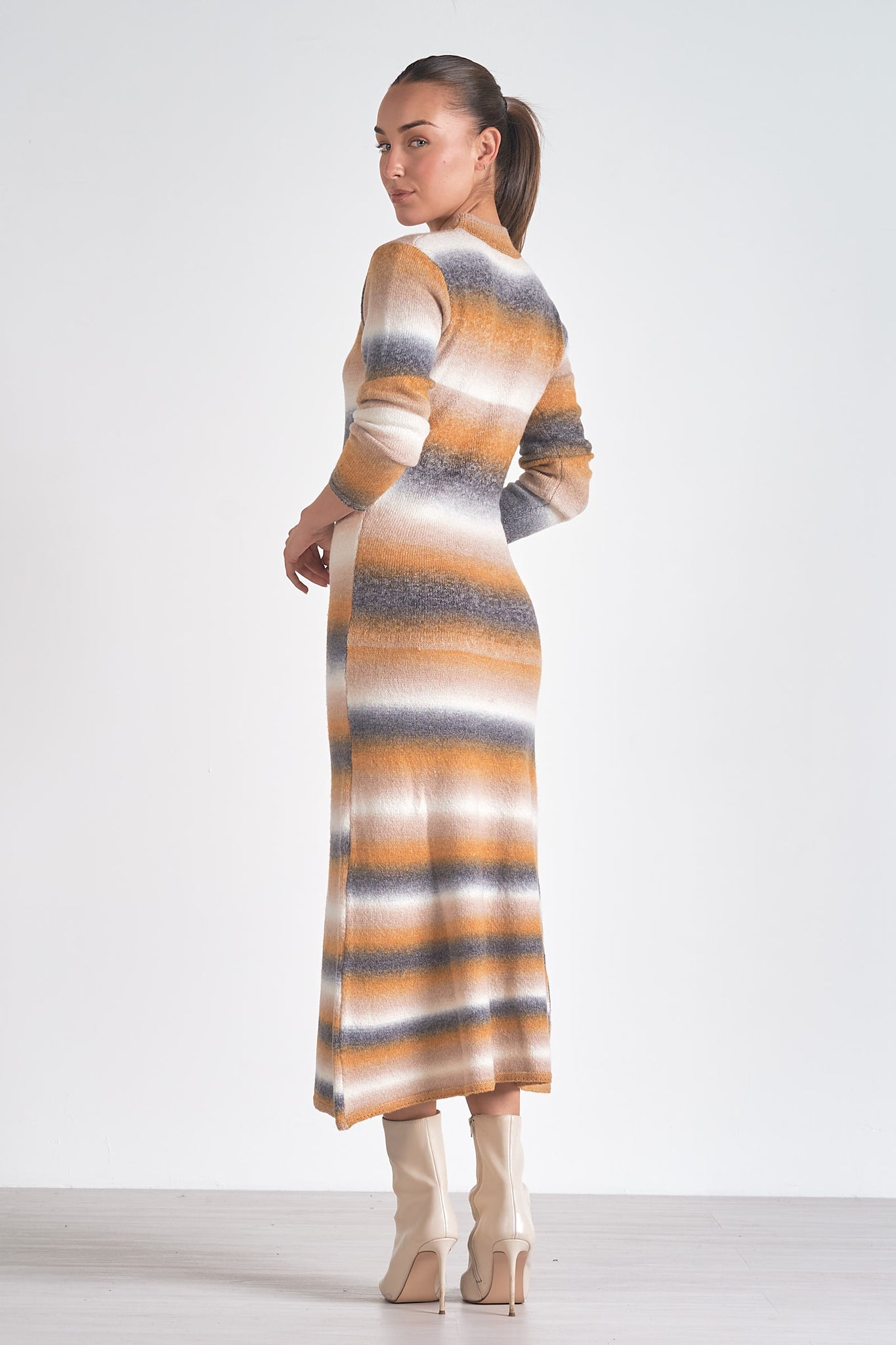 Turn up the sass factor with the Elan Baske sweater dress. This dress combines cozy comfort with stylish flair, making it the perfect choice for any occasion. With its playful design and soft fabric, you'll be turning heads and feeling fabulous all day long.