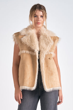 Take your style to new heights with our Elan Telluride vest. This long faux fur vest adds a playful touch to any outfit. Stay cozy while turning heads with this unique piece. Step up your fashion game with Elan Telluride.