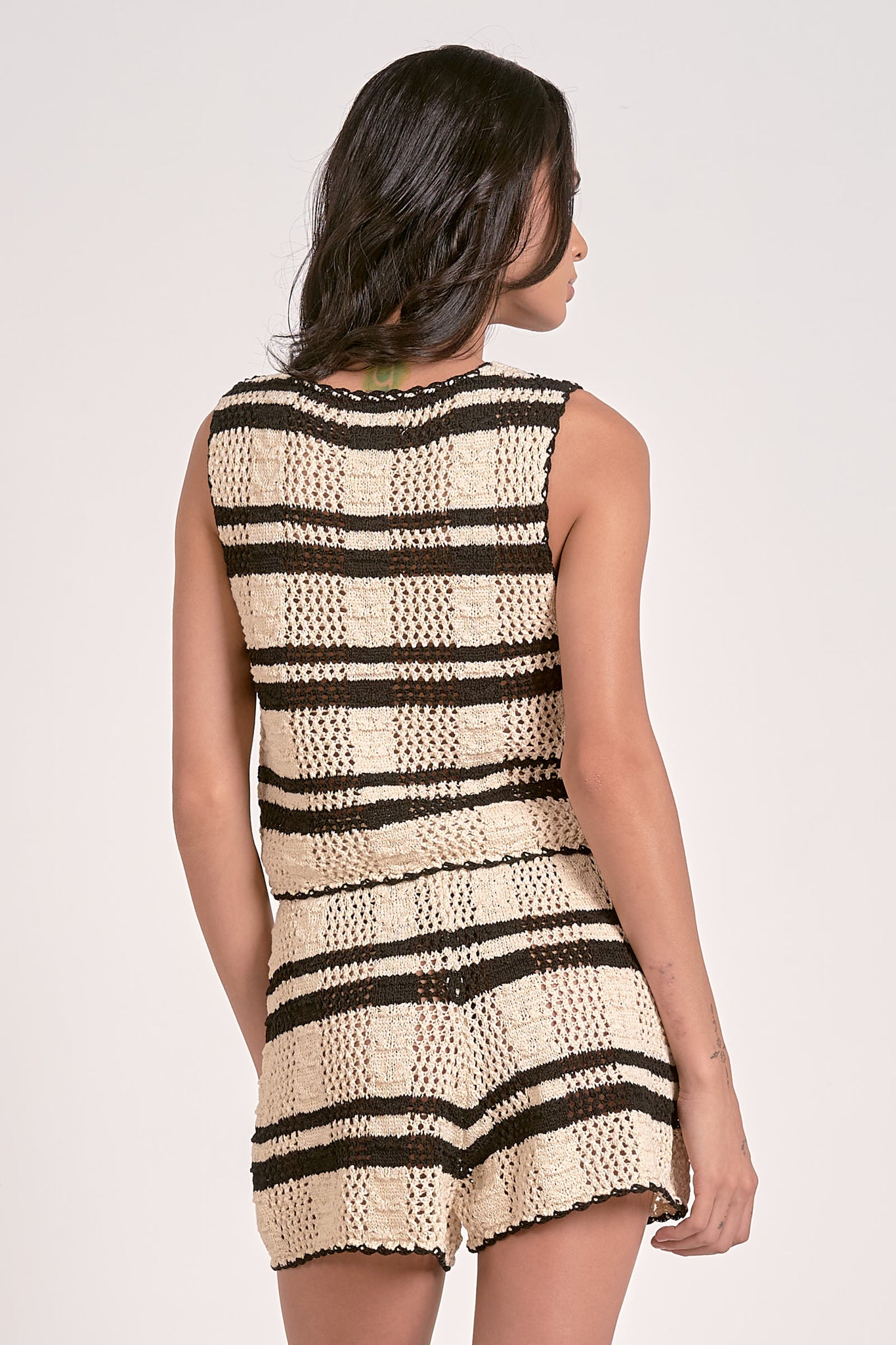 Wrap yourself in cozy chic with our Francesca knit tie front vest! This playful layering piece adds instant style to any outfit. Tie it snug or loose for different looks – perfect for brunch dates or casual office days. The versatile design transitions effortlessly from season to season, making outfit planning a breeze!