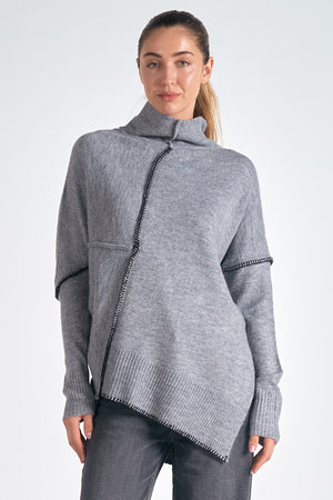 Stay warm and stylish with the Vanilla Sweater. The jumbo turtleneck offers superior warmth, while the asymmetrical design and contrast stitching add a touch of uniqueness. Whether paired with jeans or skirts, the Vanilla Sweater provides cozy comfort without compromising on style.