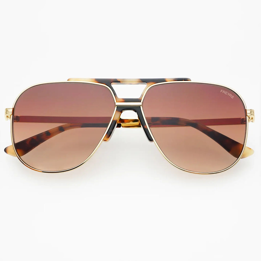 Aviator sunglasses with gold frame and brown lenses on a white background