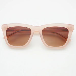 Sunglasses with a pink frame and brown lenses on a white background