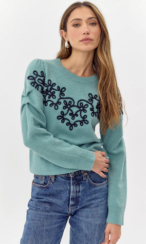 Add a touch of quirkiness to your wardrobe with Greylin's Cooper embroidered sweater. Playfully embroidered with unique designs, this sweater will have you standing out in style. Effortlessly blend fashion and fun with this must-have piece.