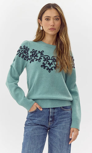 Add a touch of quirkiness to your wardrobe with Greylin's Cooper embroidered sweater. Playfully embroidered with unique designs, this sweater will have you standing out in style. Effortlessly blend fashion and fun with this must-have piece.