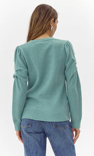 Add a touch of quirkiness to your wardrobe with Greylin's Cooper embroidered sweater. Playfully embroidered with unique designs, this sweater will have you standing out in style. Effortlessly blend fashion and fun with this must-have piece.