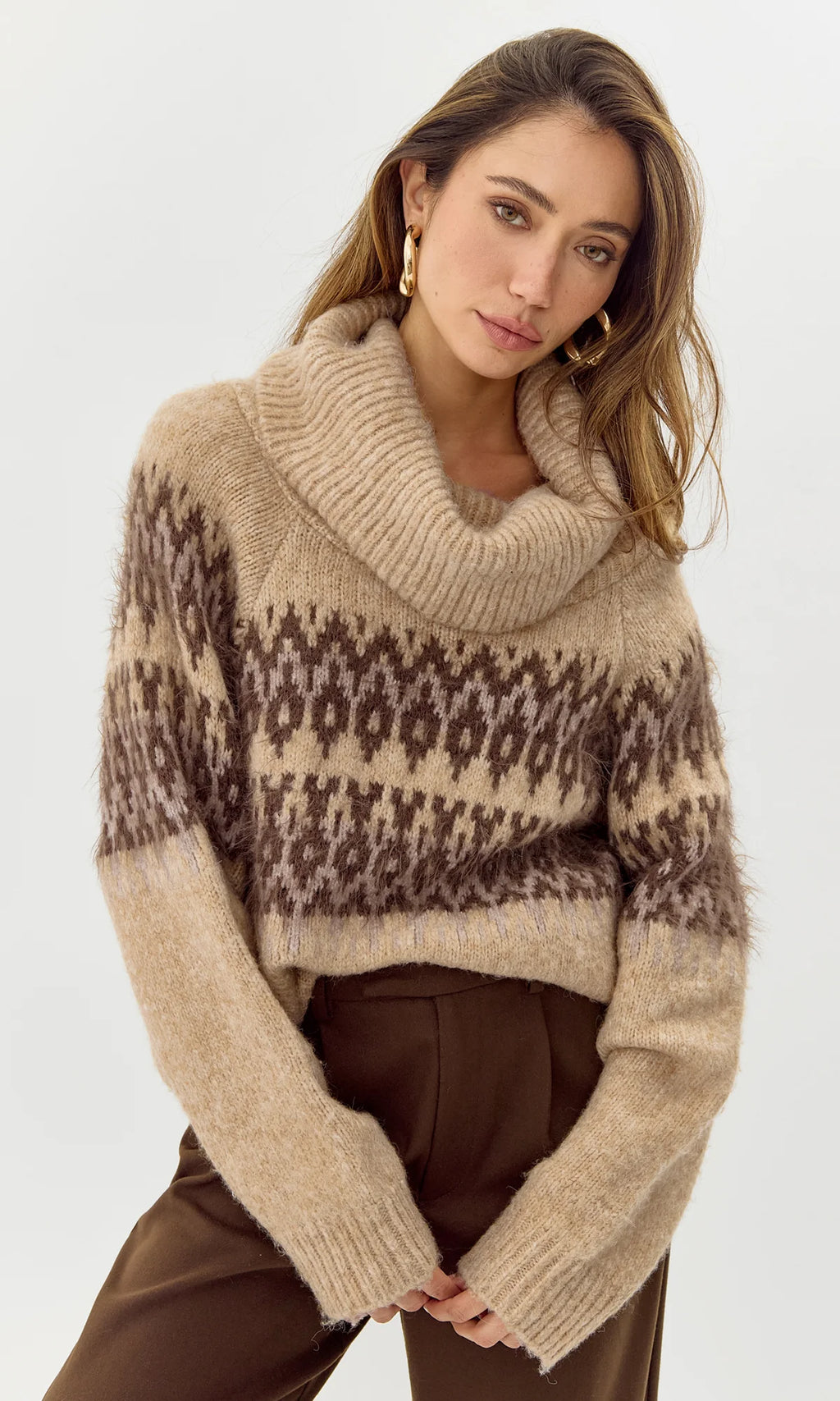 Stay cozy and stylish with the Greylin Harris funnel neck sweater. This sweater's unique design features a high neckline that not only keeps you warm but also adds a touch of elegance to any outfit. It's the perfect addition to your fall and winter wardrobe.