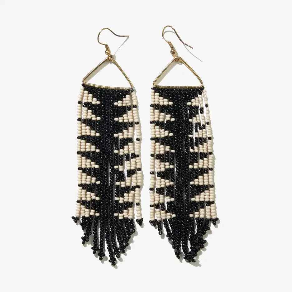 Black and white beaded fringe earrings on a white background