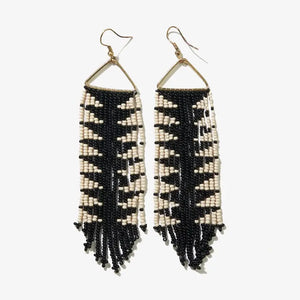Black and white beaded fringe earrings on a white background