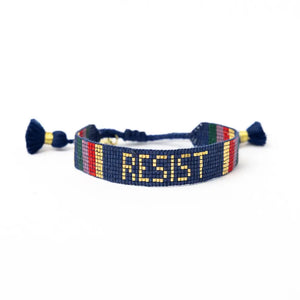 Bracelet with 'RESIST' in yellow on a blue background
