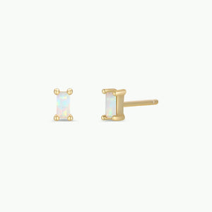 Gold stud earrings with rectangular gemstones on a white background