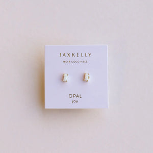 Jaxkelly opal joy earrings on a branded card with a light pink background