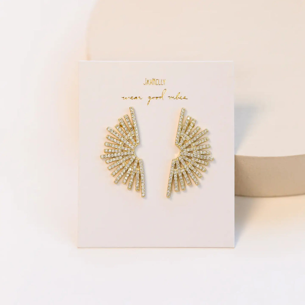 Our bold Sunburst Drop earrings feature a large sunburst pattern of pave stones. These earrings are perfect for any occasion with their timeless sophistication.