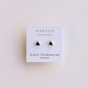 Jaxkelly black tourmaline strength earrings on a white card with a beige background