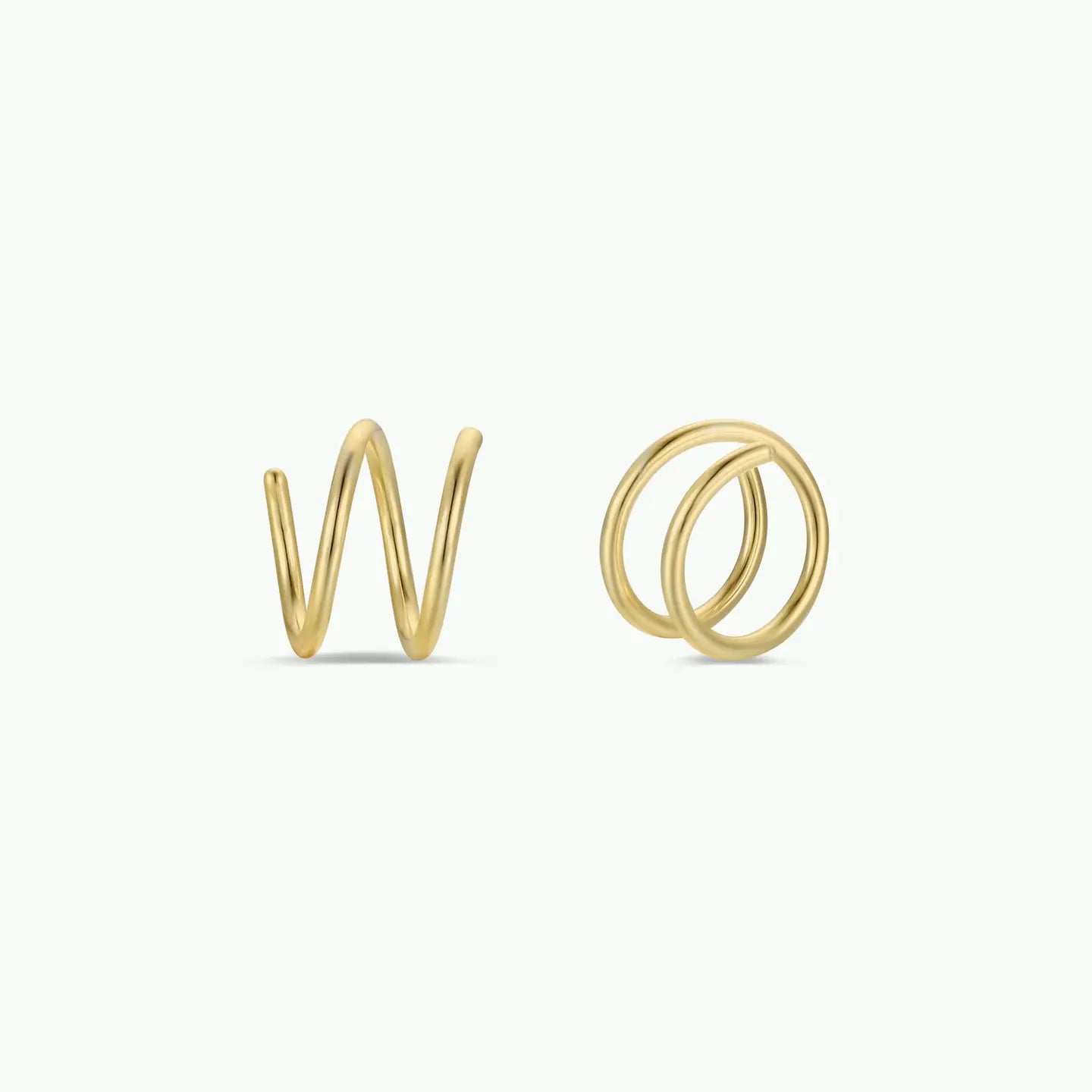 Gold spiral earrings on a white background