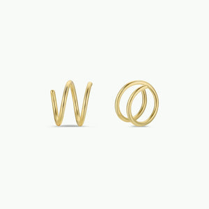 Gold spiral earrings on a white background