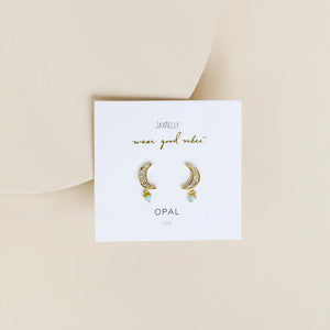 Gold hoop earrings on a white card with 'Jax & Cleo' branding on a beige background