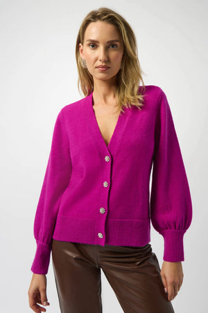 Add a touch of fun to your wardrobe with this cardigan featuring sparkling buttons that catch the light and charming puff sleeves for a flirty silhouette. Perfect for layering, it brings a playful twist to any outfit while keeping you cozy and stylish.