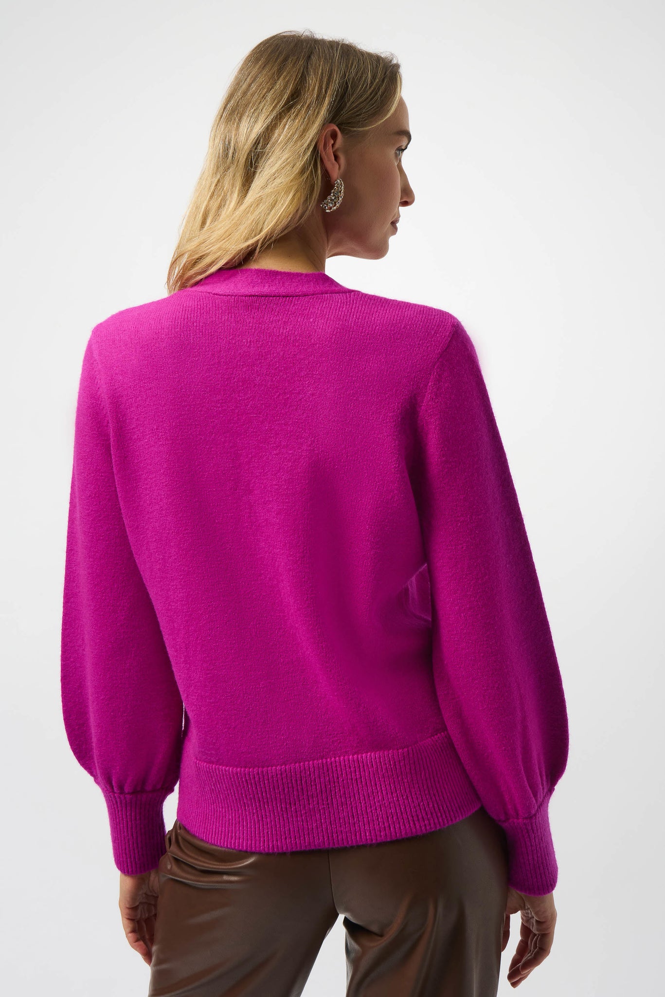 Add a touch of fun to your wardrobe with this cardigan featuring sparkling buttons that catch the light and charming puff sleeves for a flirty silhouette. Perfect for layering, it brings a playful twist to any outfit while keeping you cozy and stylish.