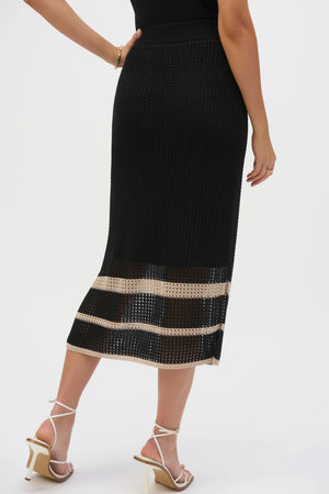 Cut from a delectable sweater knit featuring open stitch detailing and placement stripes, this sophisticated skirt makes a smart addition to your wardrobe. Finished with a comfortable elastic waistband, sultry side slits, and lightweight knit lining, this piece can be worn with its matching coverup for a coordinated look.