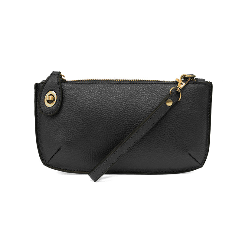 Black leather crossbody bag with gold accents on a white background