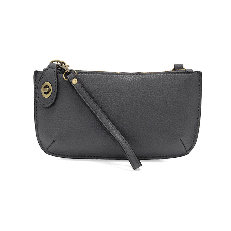 Black leather wristlet with a strap on a white background