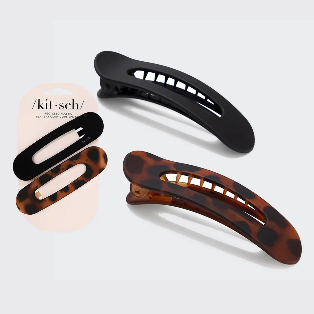 Set of three hair clips in black, tortoiseshell, and beige on a light gray background.