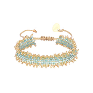 Spice up your arm party with Mishky's adjustable beaded bracelet, giving you both style and versatility. Stand out from the crowd with this one-of-a-kind accessory.