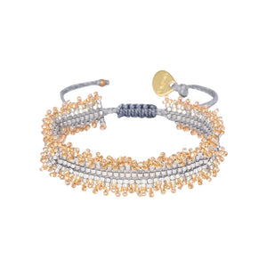 Spice up your arm party with Mishky's adjustable beaded bracelet, giving you both style and versatility. Stand out from the crowd with this one-of-a-kind accessory.