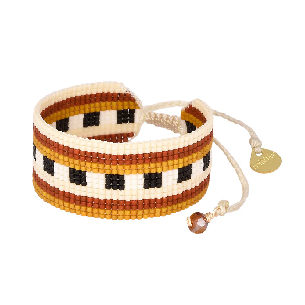 Get ready to "bridge" the gap between style and fun with Mishky's beaded adjustable bracelet. Whether you're looking to add some quirkiness to your outfit or just want to make a playful statement, this bracelet has got you covered! (No serious fashionistas allowed!)