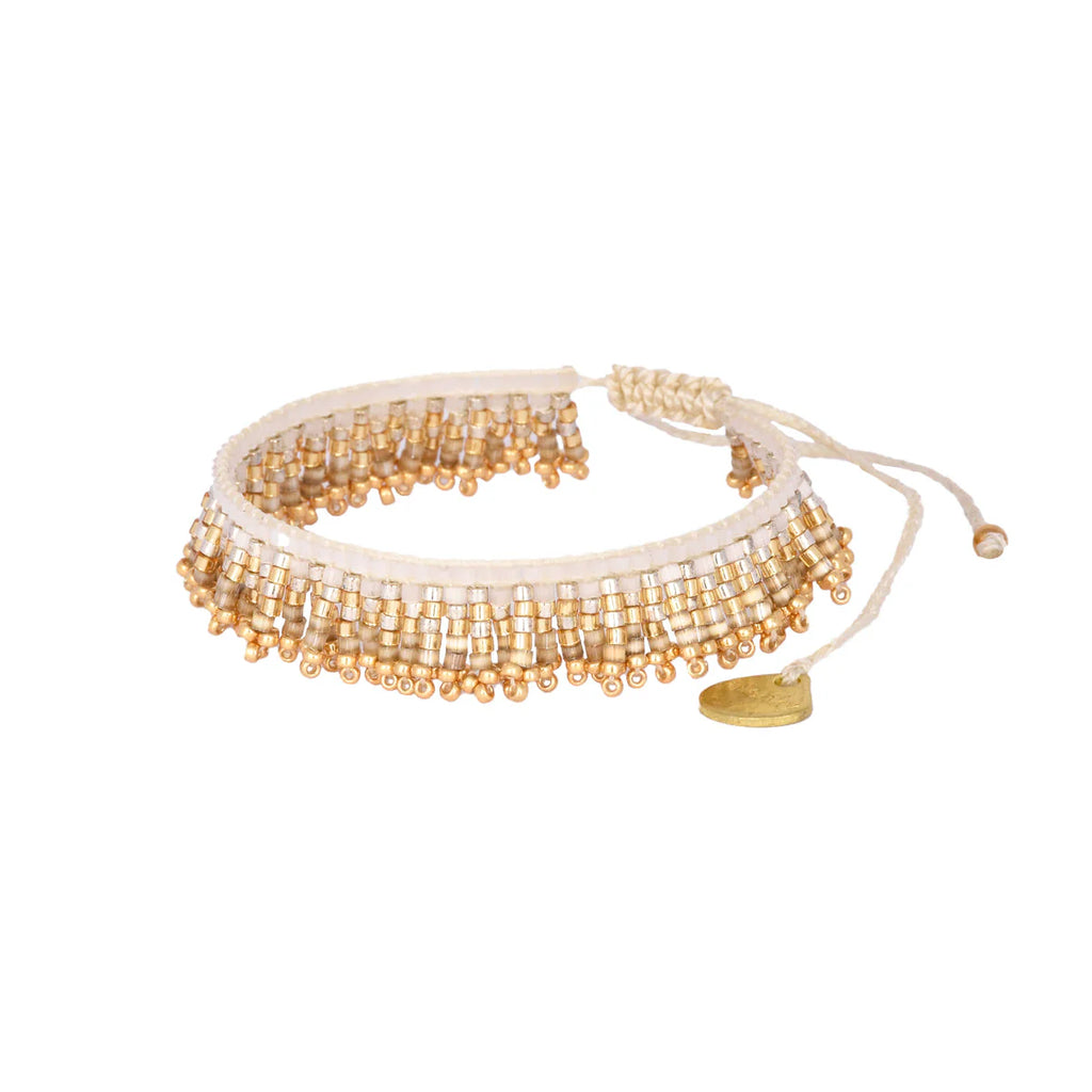 Layer with fun! This thin fringy bracelet is perfect for friendship and playful vibes