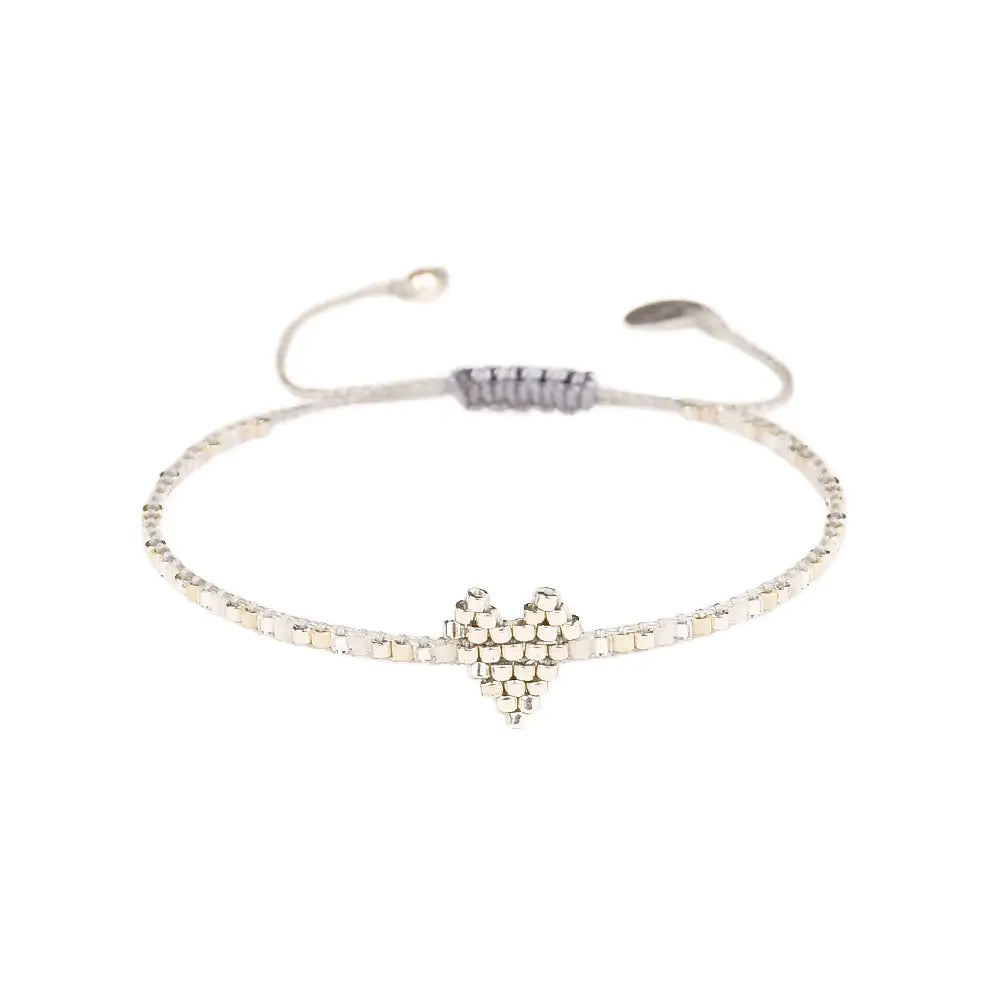 Spread love with Mishky's Heartsy bracelet. This thin adjustable piece features a beaded heart, perfect for layering with your favorite bracelets or sharing with a friend. Show your quirky side and wear your heart on your wrist!