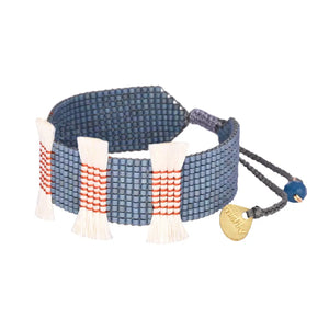 Add some playful charm to your ensemble with Mishky's Mini Tassels necklace. Featuring colorful beaded tassels and an adjustable chain, this accessory adds a touch of whimsy to any outfit.