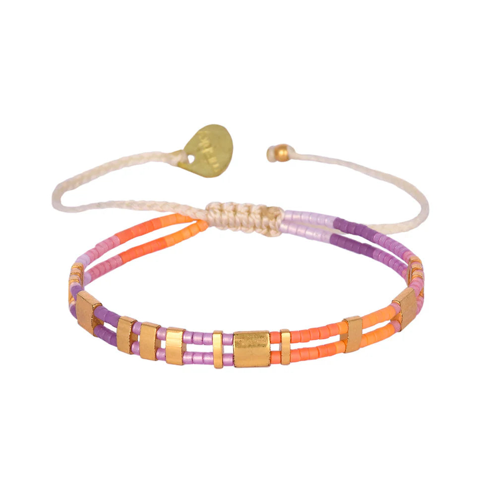 Add a touch of boho-chic to any outfit with Mishky's Scala bracelet. Featuring vibrant beads on an adjustable band, this bracelet is not only stylish but also comfortable to wear. Don't miss out on this unique accessory! (Beads-cause the envy of all your friends!)