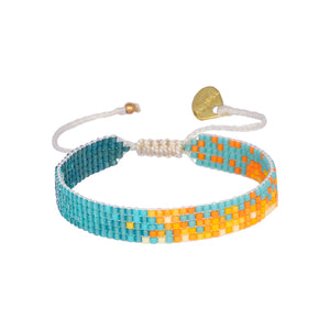 Add some brightness to your wrist with Mishky's sunset adjustable bracelet. Perfect for any time of day, this bracelet is sure to catch the eye and add a touch of fun to any outfit.