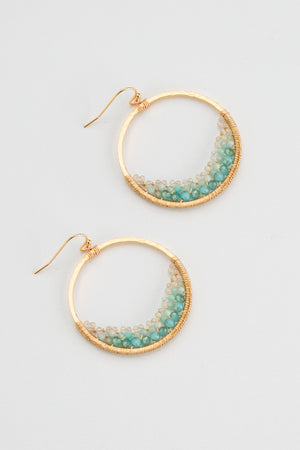 Add a splash of charm to your look with these gold and amazonite hoop earrings. Their vibrant amazonite stones bring a pop of color, while the sleek gold hoops add a touch of elegance. Perfect for brightening up any outfit with a playful twist!