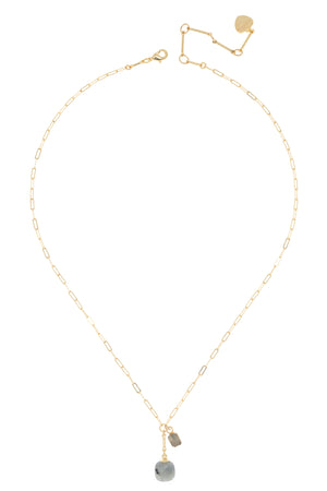 Gold necklace with small pendants on a white background