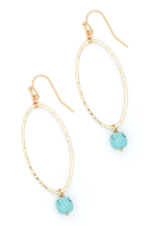 Elevate your ensemble with these elegant oval earrings, adorned with a striking turquoise drop. Ideal for both special occasions and daily wear, they offer a refined burst of color that enhances any outfit. Designed to be lightweight and captivating, these earrings effortlessly combine sophistication with subtle charm.