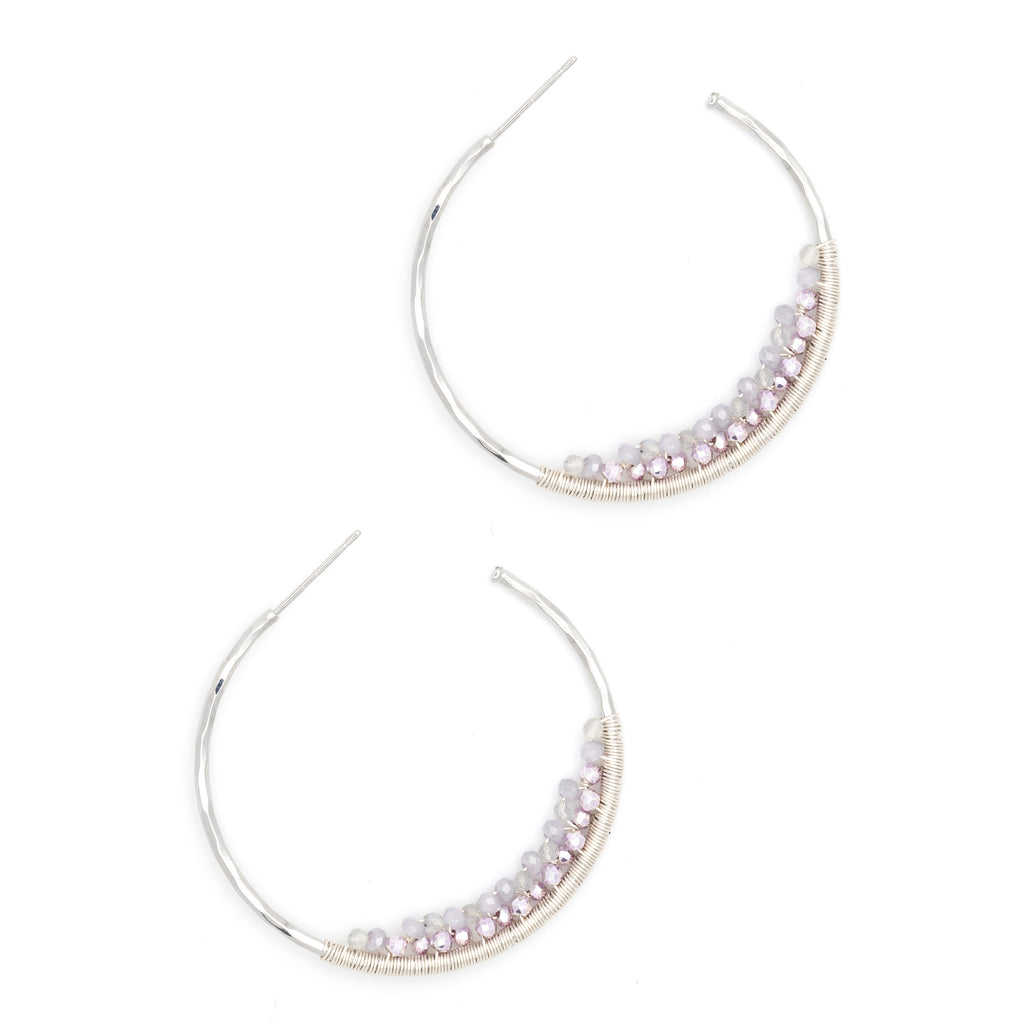 Add a pop of color to your look with these silver post hoops featuring vibrant purple beads. Lightweight and fun, they’re perfect for brightening up any outfit with a playful twist. Easy to wear and sure to catch eyes wherever you go!