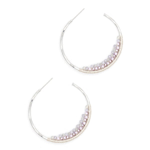 Add a pop of color to your look with these silver post hoops featuring vibrant purple beads. Lightweight and fun, they’re perfect for brightening up any outfit with a playful twist. Easy to wear and sure to catch eyes wherever you go!