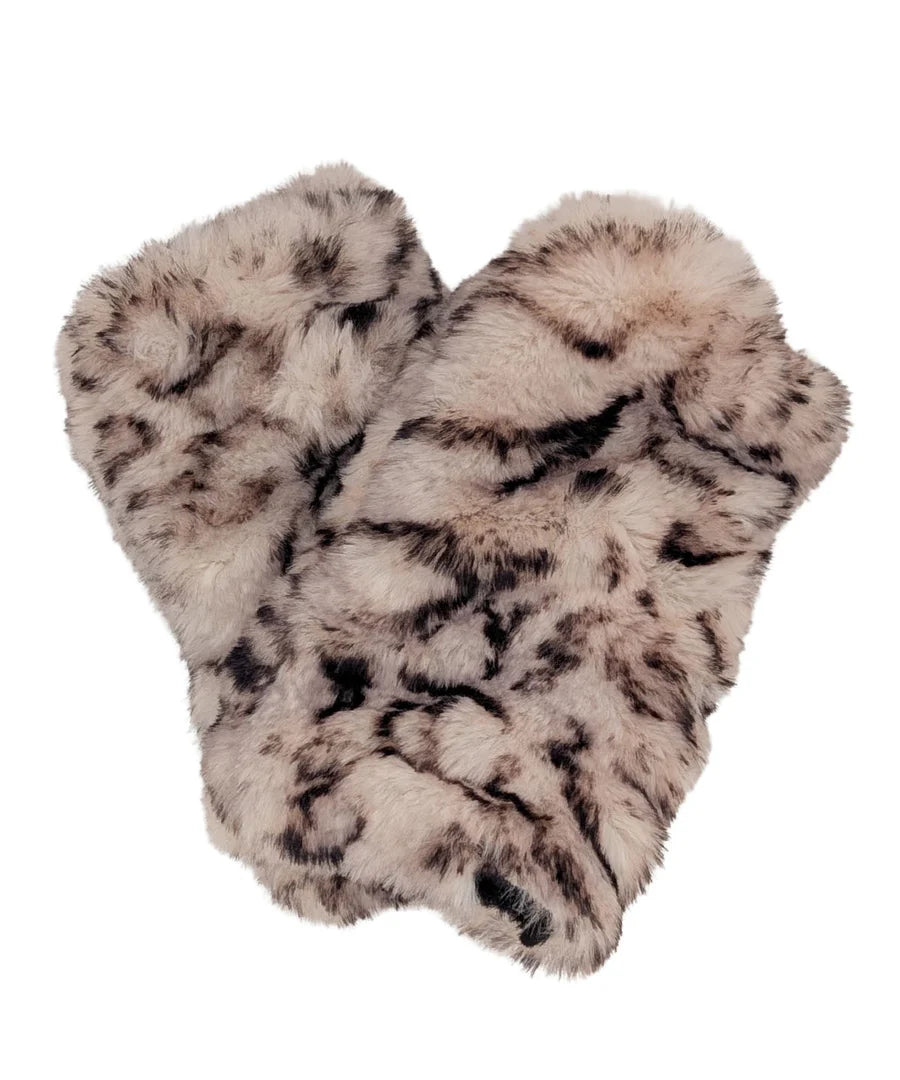 Pair of fluffy animal print slippers on a white background