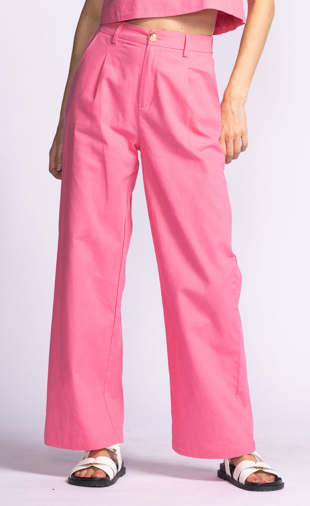 Introducing the Delaney Pant, a playful and stylish addition to any wardrobe! These pink trousers will add a pop of color and personality to any outfit. Perfect for those who like to have fun with their fashion.