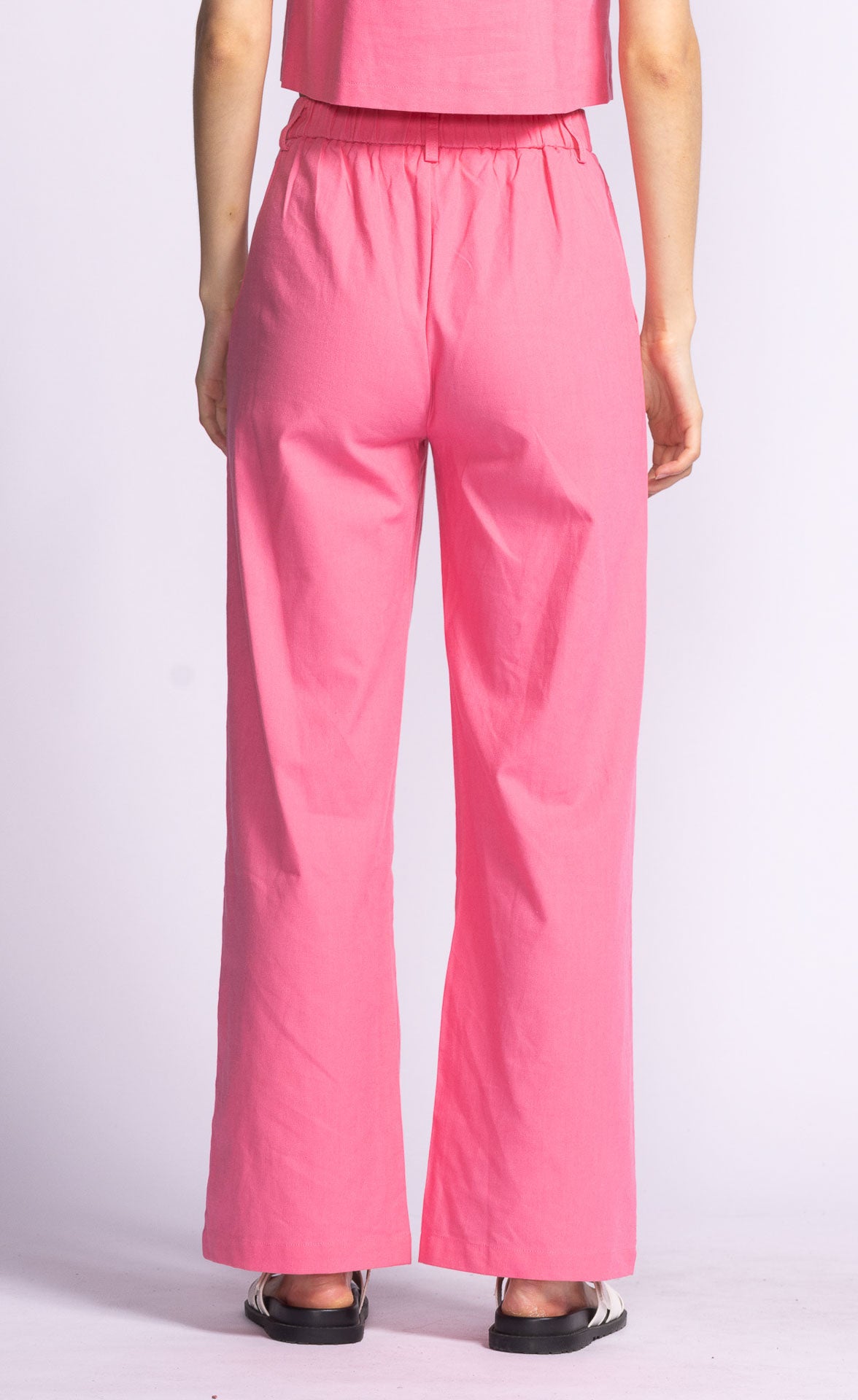 Introducing the Delaney Pant, a playful and stylish addition to any wardrobe! These pink trousers will add a pop of color and personality to any outfit. Perfect for those who like to have fun with their fashion.