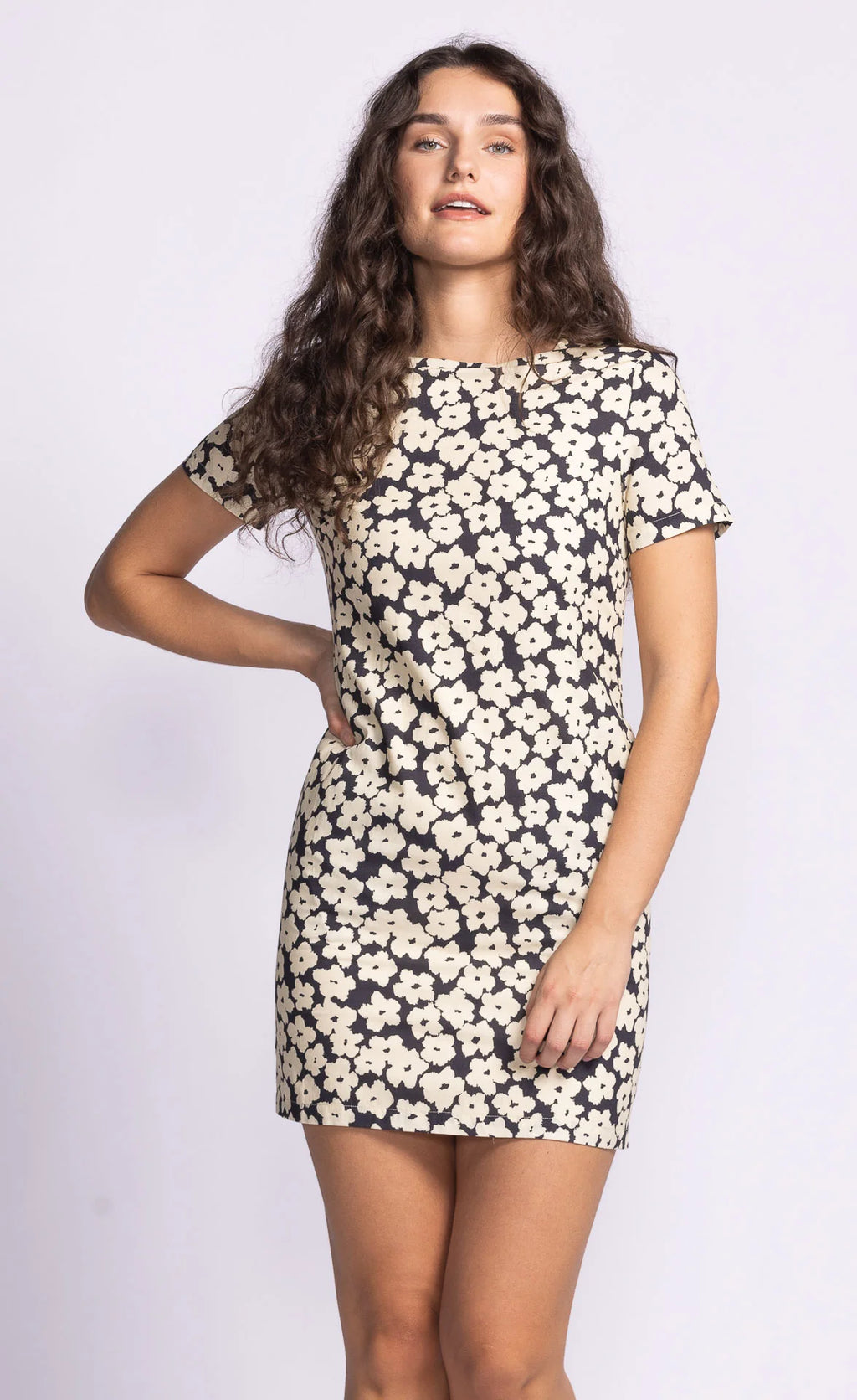The Charli Dress is a chic shift dress featuring a dainty print, offering a flattering and timeless silhouette. Style it with statement accessories for a polished look or keep it simple with flats for everyday wear.