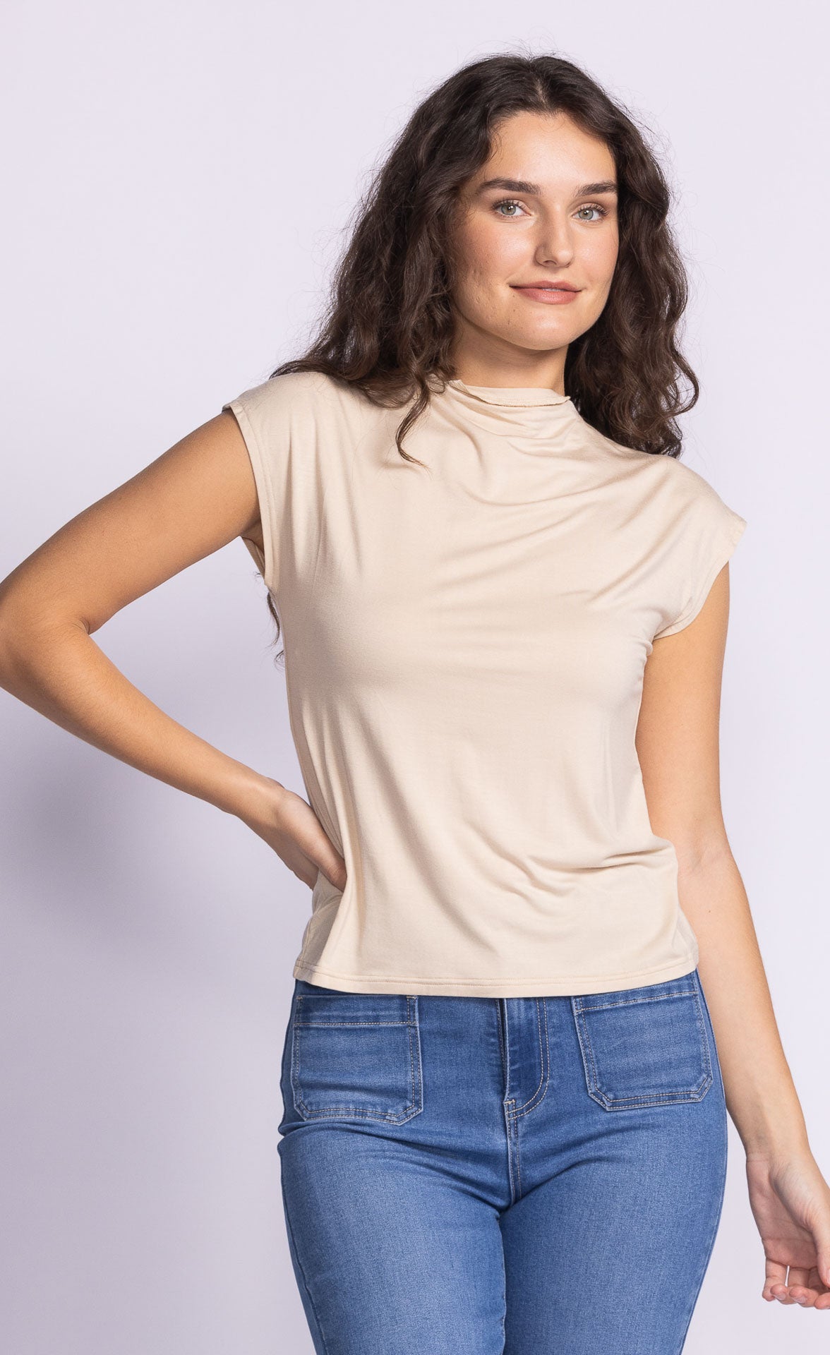 Unleash your playful side with Pink Martini's Shannon high neck tee. Don't let the basic style fool you, this tee comes with endless possibilities for mixing and matching, making it a versatile addition to your wardrobe. Get ready to turn heads with this quirky and fun essential.