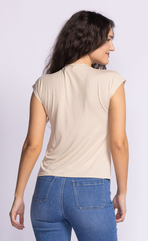 Unleash your playful side with Pink Martini's Shannon high neck tee. Don't let the basic style fool you, this tee comes with endless possibilities for mixing and matching, making it a versatile addition to your wardrobe. Get ready to turn heads with this quirky and fun essential.