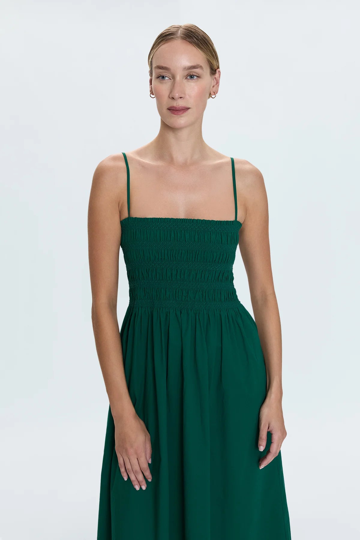 Breezy day dress crafted from a flowing, lightweight fabrication designed for warm weather wear. Smocked bodice with ruched design details, topped with adjustable shoulder straps.&nbsp;