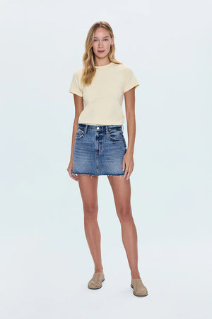 Jaunty mini skirt that sits low on the hips for breezy, cool-girl styling. Crafted from rigid non-stretch denim for an expert fit, and offered in a medium blue denim wash with blasted fading.