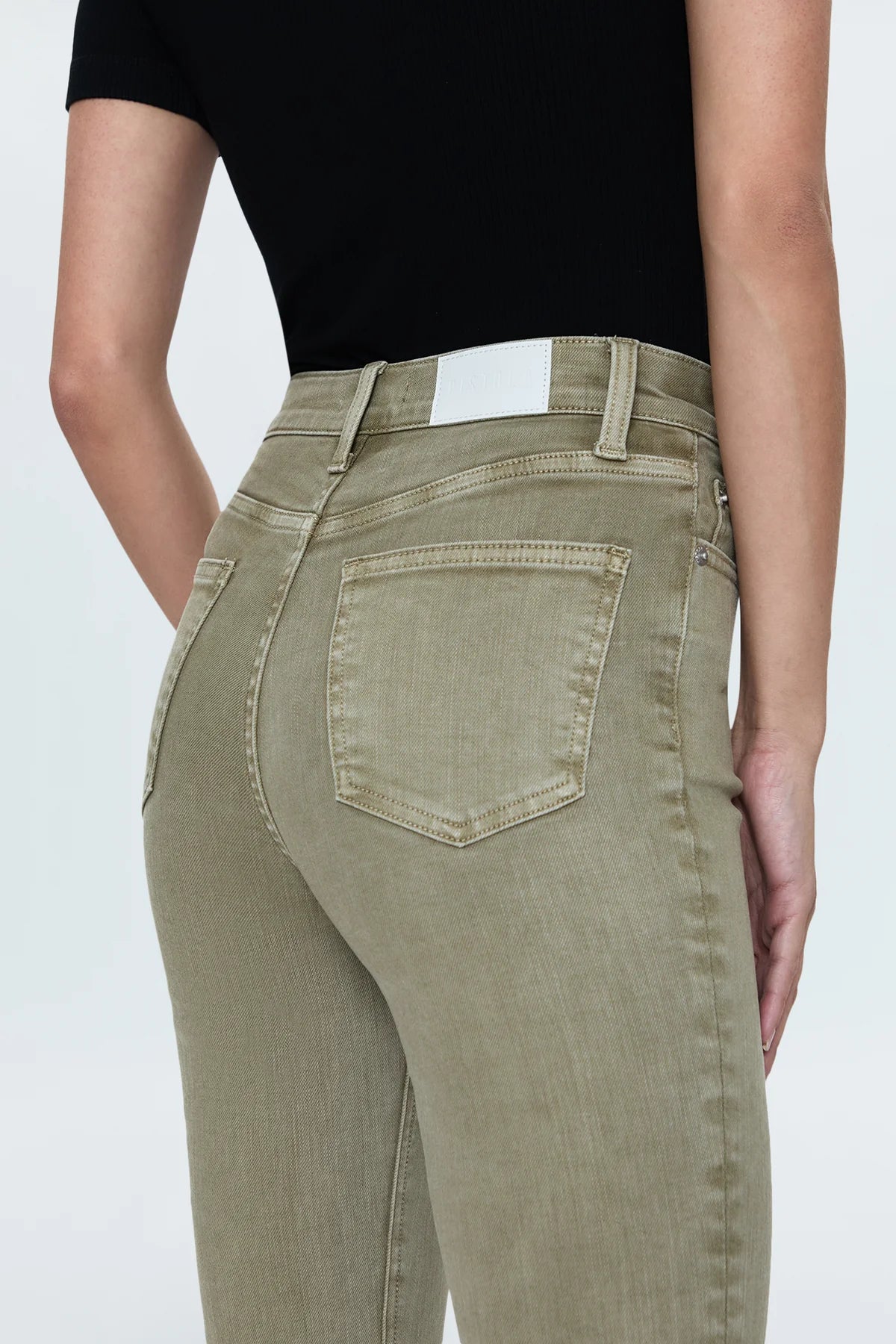 Our best selling bootcut silhouette with a high rise waist and 27" hem length with a clean finish. Crafted from our best selling comfort-stretch denim with clean finishes and free of distressing. Green Willow is a soft, warm olive green colored denim with tonal stitching and chrome hardware.